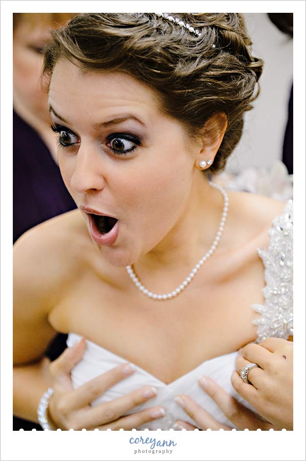 bride getting dressed at st joan of arc in canton ohio