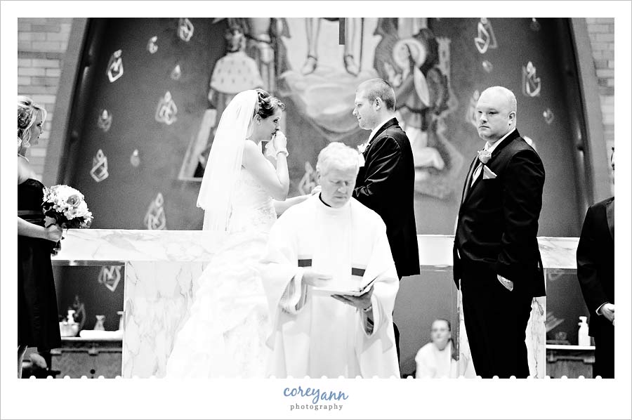 bride crying during wedding ceremony at st joan of arc in canton ohio