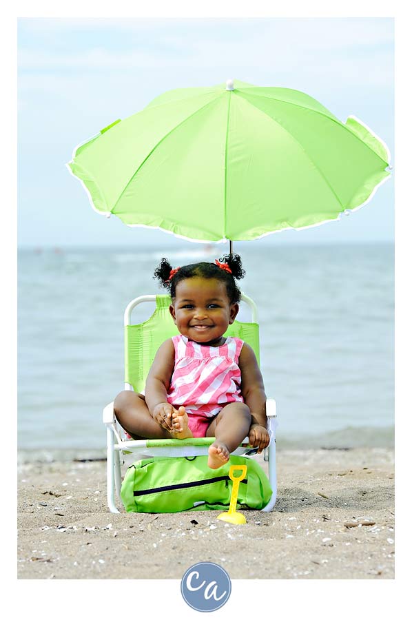 Brianna's One Year Portrait one year old in beach chair on the beach