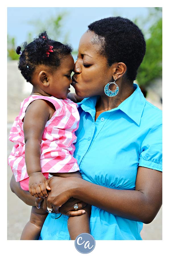 Brianna's One Year Portrait mom kissing baby's nose