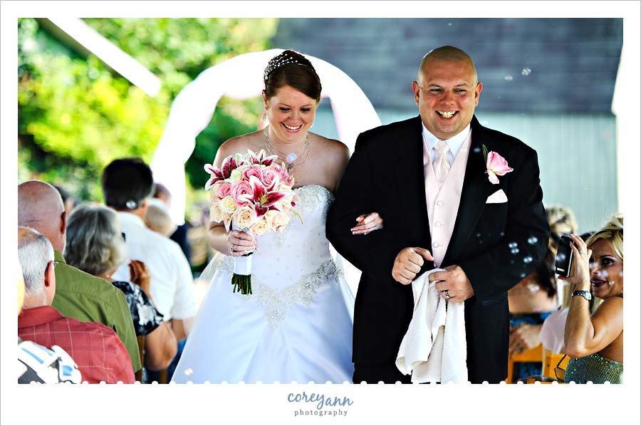 bride and groom walking down the aisle together in alliance ohio