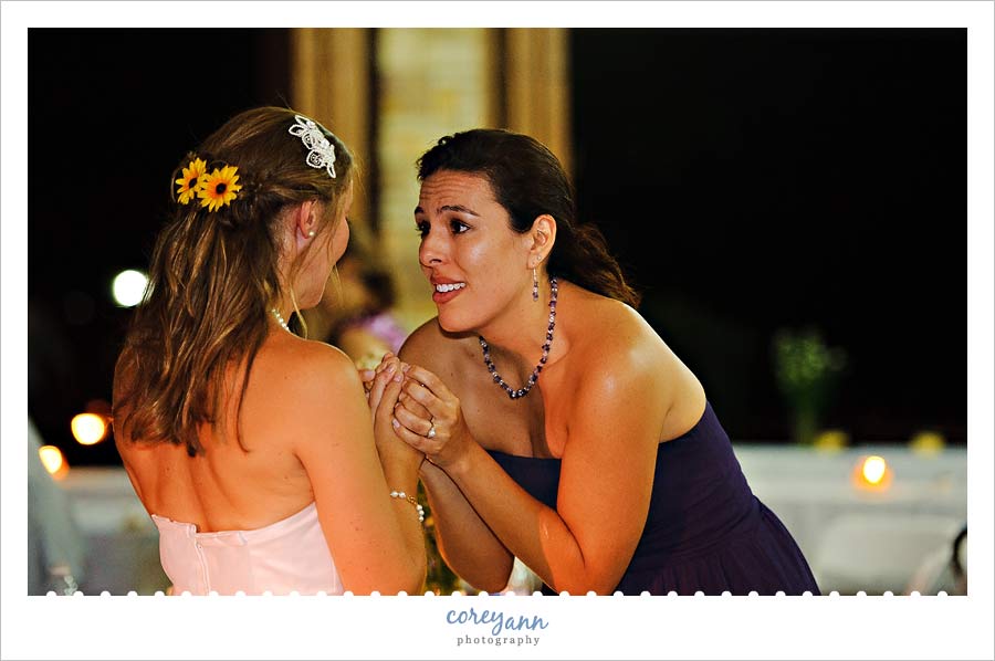 Chrissanna and Robert's Wedding in Akron bridesmaid saying goodbye to bride before she leaves reception