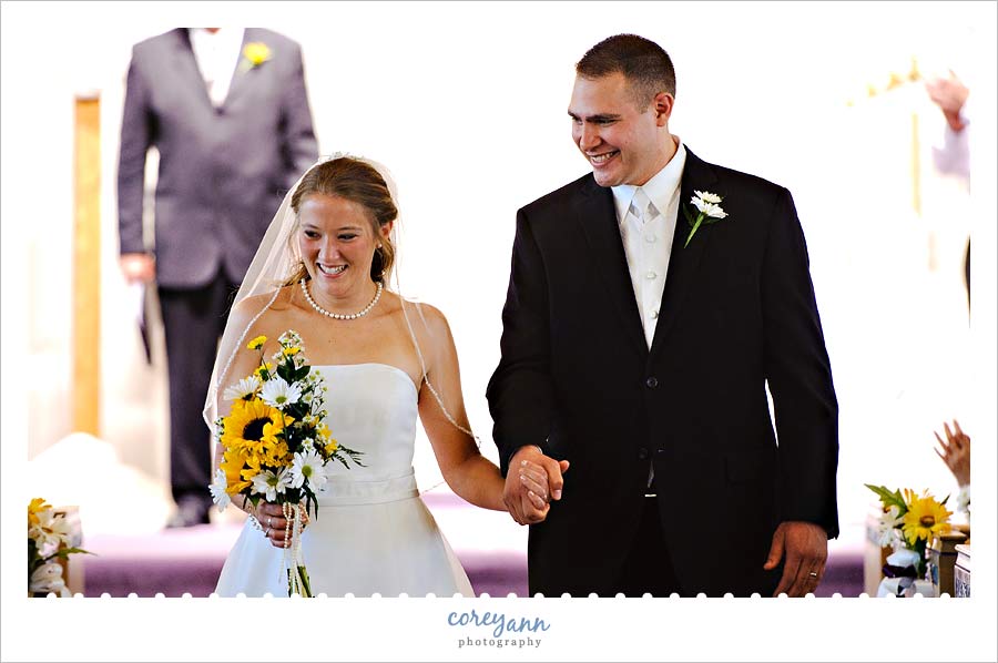 bride and groom recessing down aisle in akron ohio