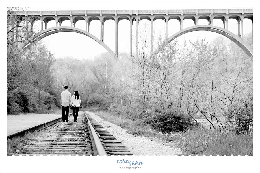 engaged couple on railroad tracks beneath brecksville-northfield high level bridge