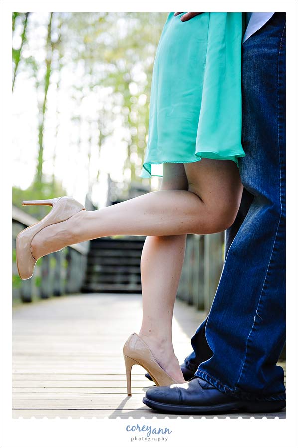 legs of engaged couple