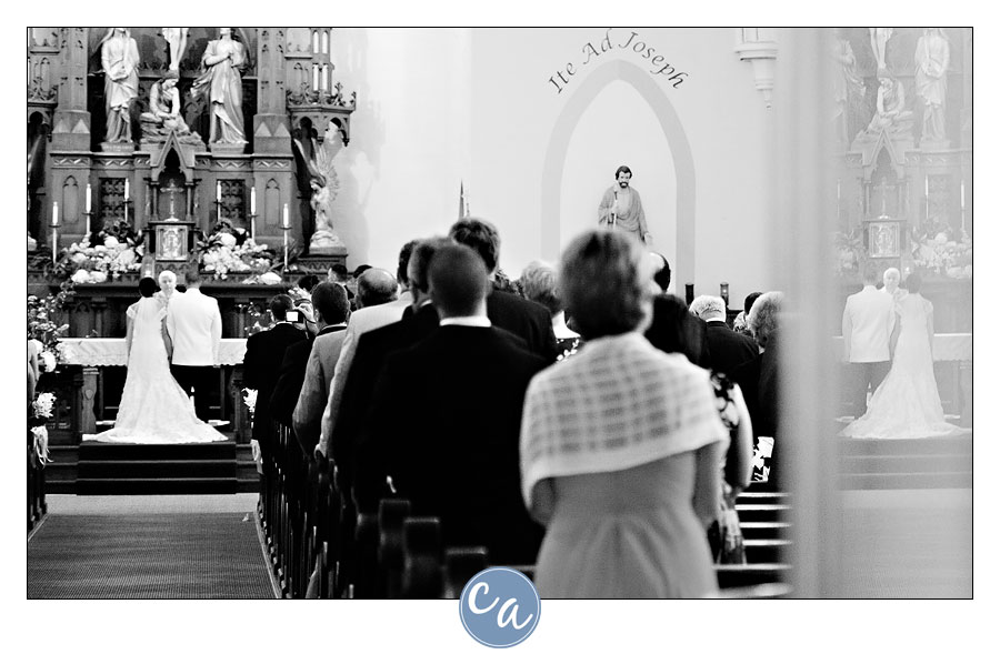 priest giving sermon during wedding service