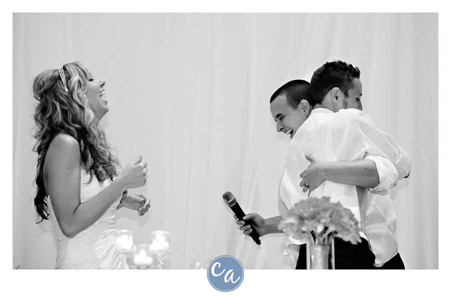 groom hugging best man after toast in sugarcreek ohio