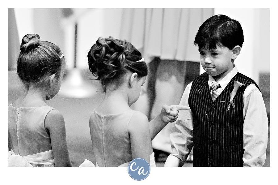 ring bearer getting scolded by flower girl