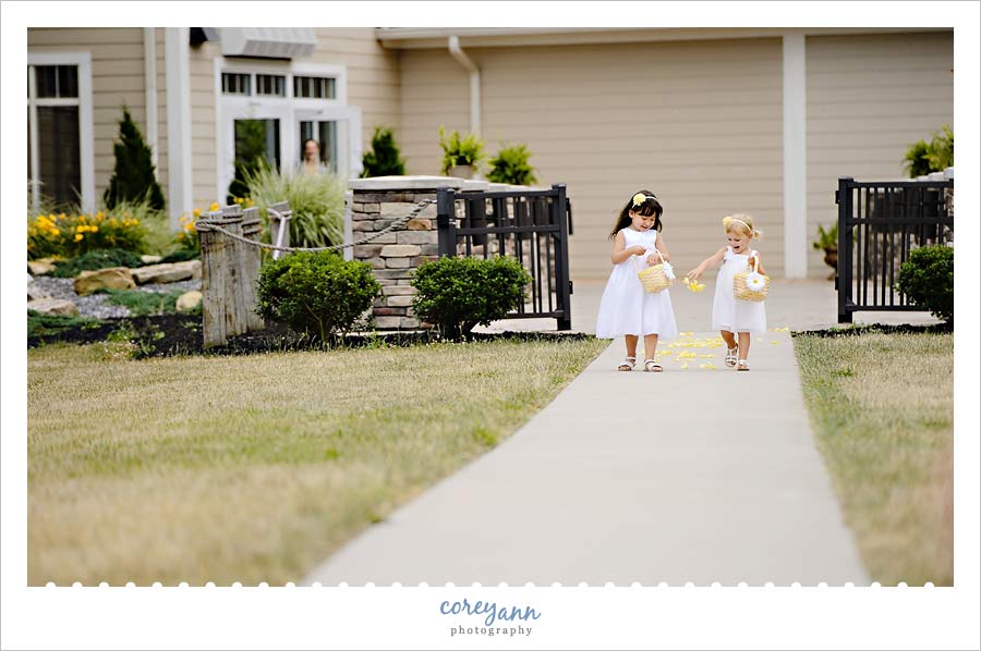 flower girls walking down the aisle 