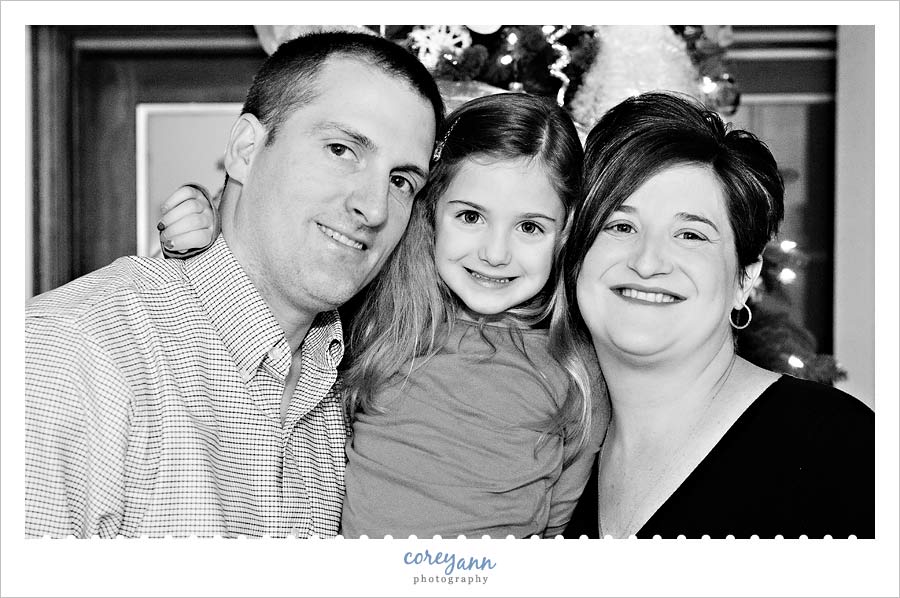 family of three portrait at christmas