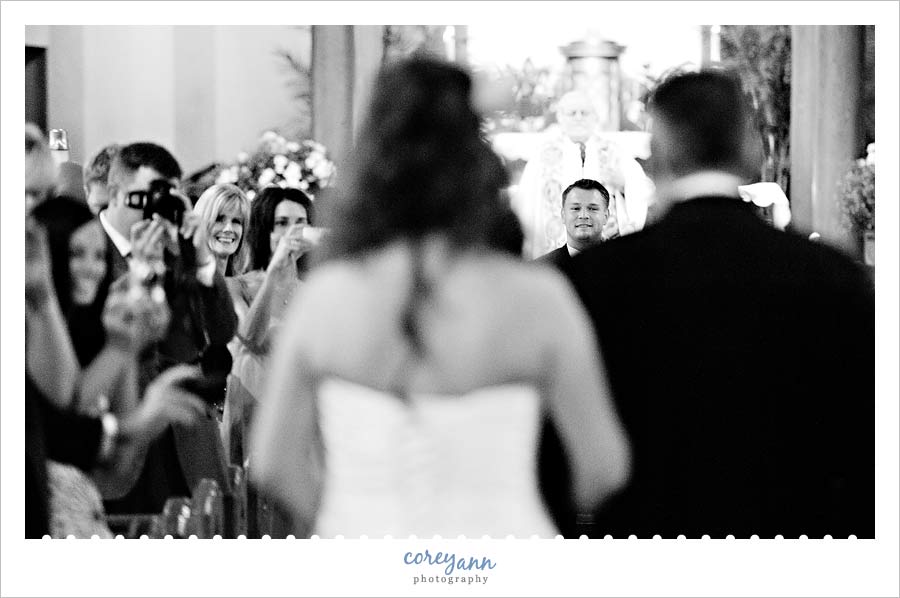 bride and father walking down the aisle at our lady of angels