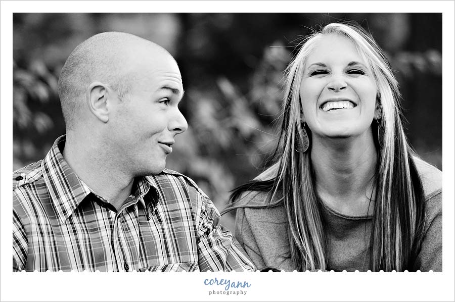couple laughing during engagement session in norton ohio