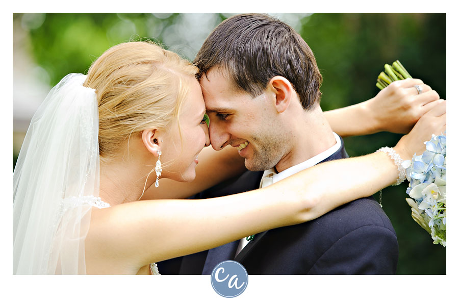 bride and groom nuzzling after ceremony at the glidden house
