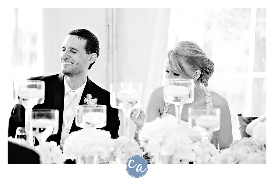 groom laughing during best men toast