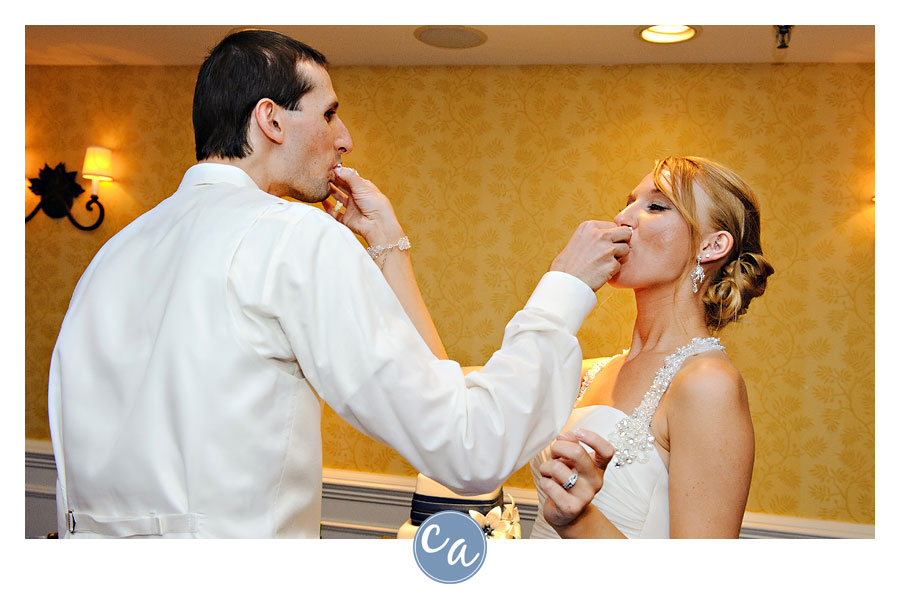 bride and groom cutting the cake from west side bakery