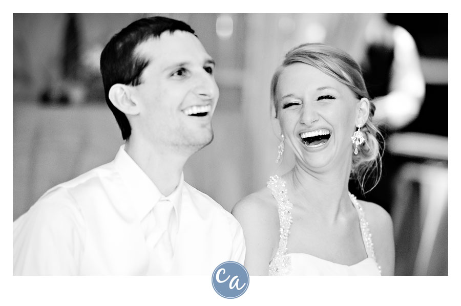 bride and groom laughing while love story is being played
