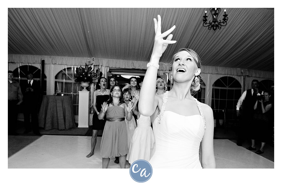 bride tossing her bouquet at the glidden house