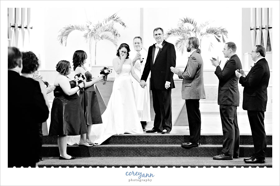 bride wiping a tear after ceremony at st marys in hudson ohio