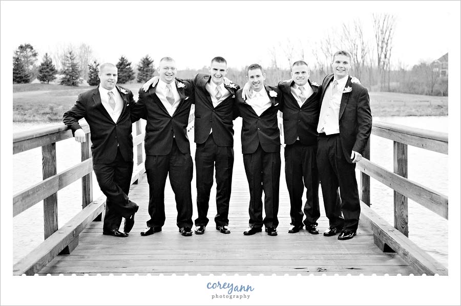 Joe & Marta's Wedding in Medina groomsman posing at blue heron golf club in medina