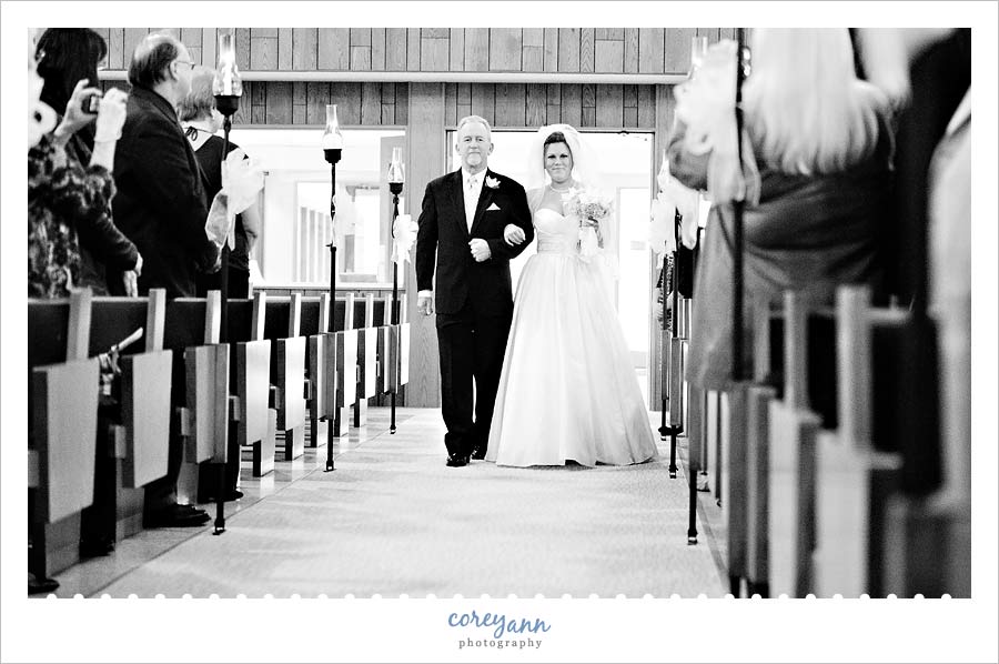 bride walking down aisle at calvary lutheran church in parma