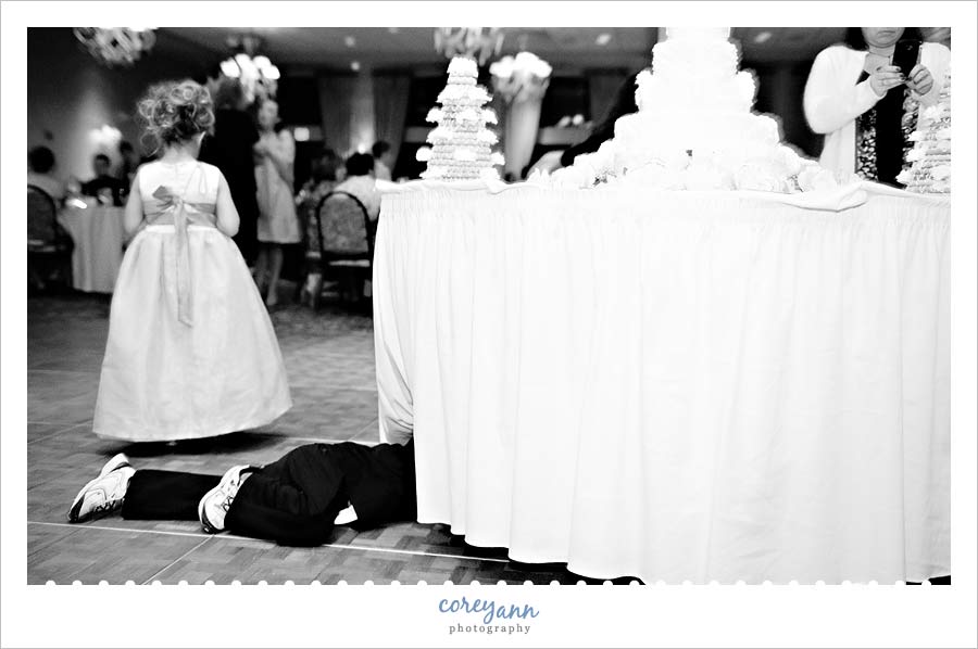 Joe & Marta's Wedding in Medina little boy under the cake table