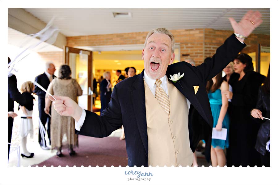 Joe & Marta's Wedding in Medina father of bride during ribbon exit after ceremony