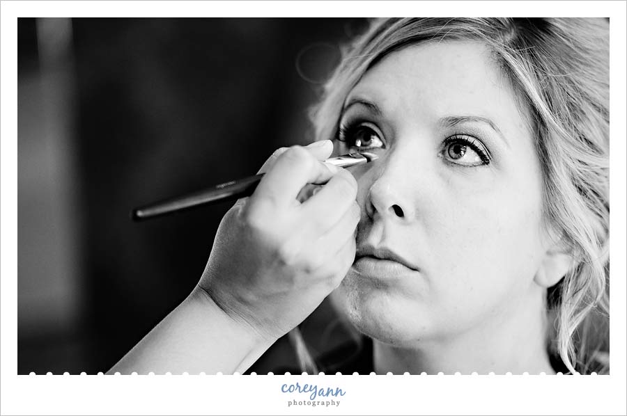 bride getting makeup applied in greenville pennsylvania