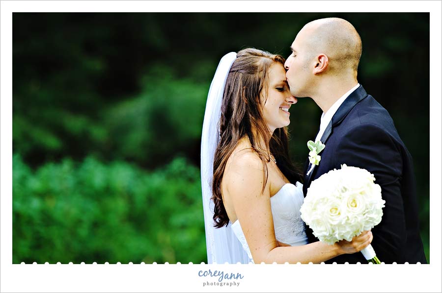 David and Kelli's Wedding groom kissing bride's forehead in dover ohio