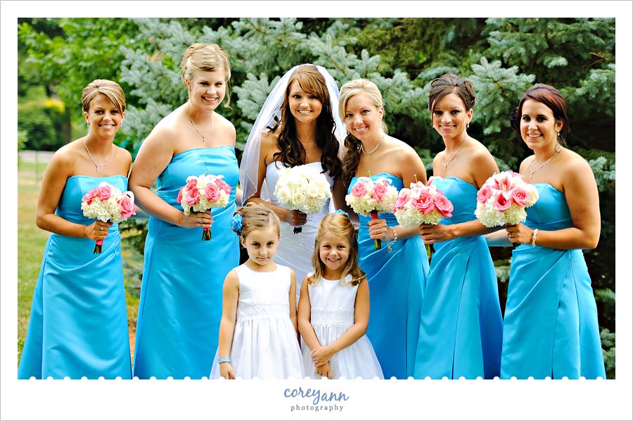 bride and bridesmaids in blue dresses