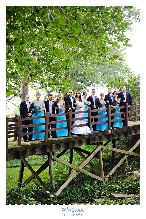David and Kelli's Wedding bridal party on bridge at warthers museum