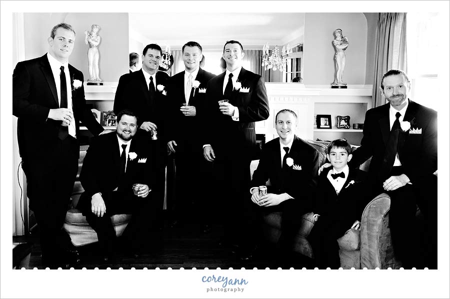 groomsman posed sitting and standing 