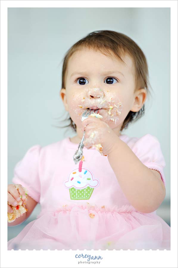 Miss Margaux | 1 Year eating cake for one year old picture