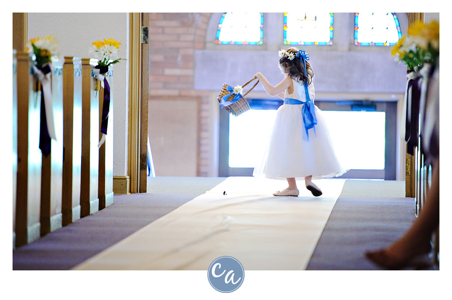 flower girl twirling down aisle at the chapel in akron ohio