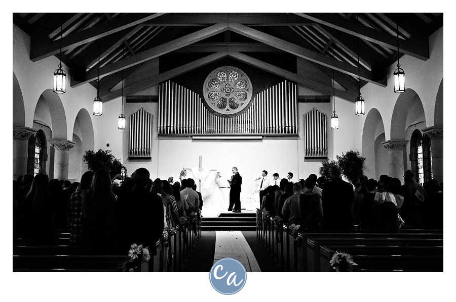bride and groom exchanging vows at the memorial chapel in akron ohio