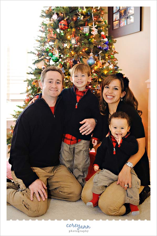 family portrait in front of christmas tree in avon ohio