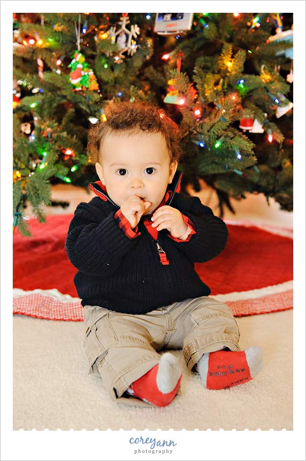 child portrait in front of christmas tree in avon ohio