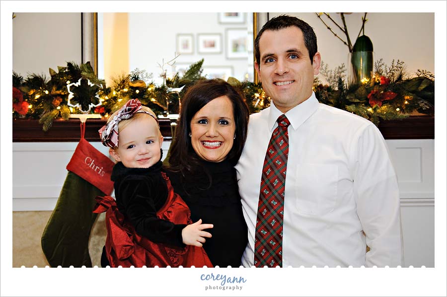 family of three posing for christmas portrait in canal fulton ohio