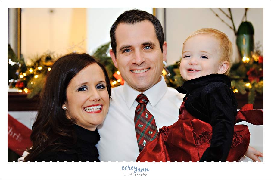 family of three posing for christmas portrait in canal fulton ohio