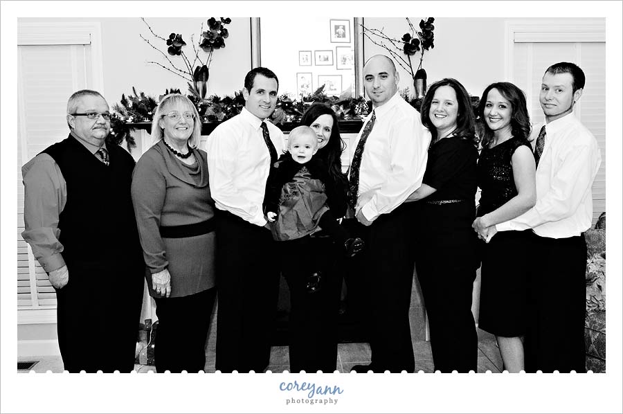 family portrait in front of fireplace