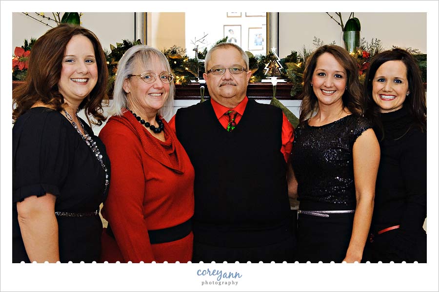 family portrait in front of fireplace