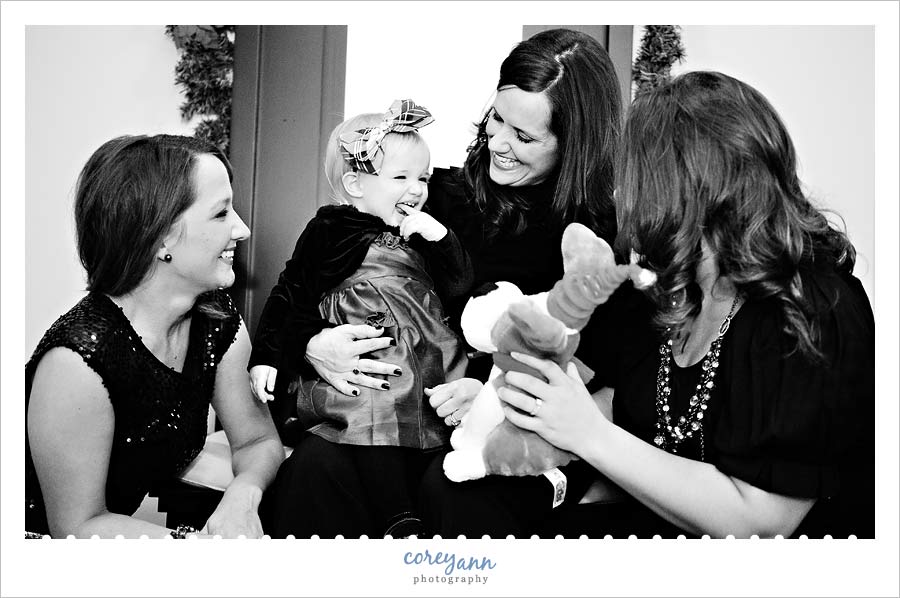 baby girl and her mom and aunts laughing