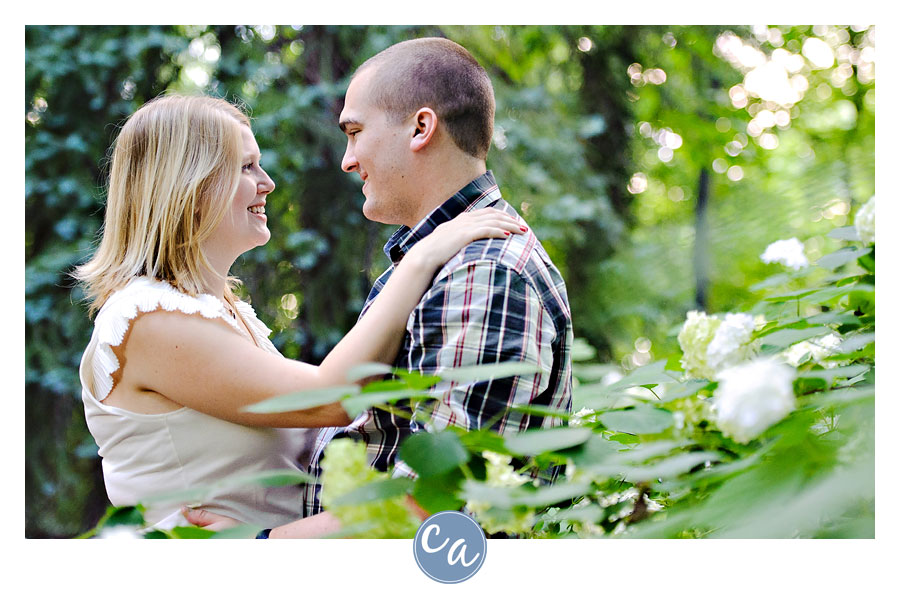 couple near hydrangea bushes