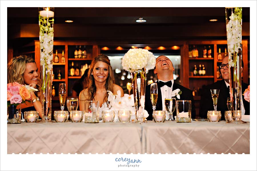 bride and groom laughing during toasts in sharon pa