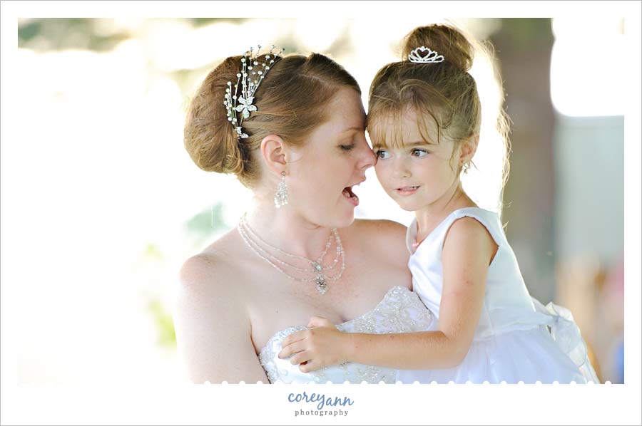bride holding flower girl during reception in alliance ohio