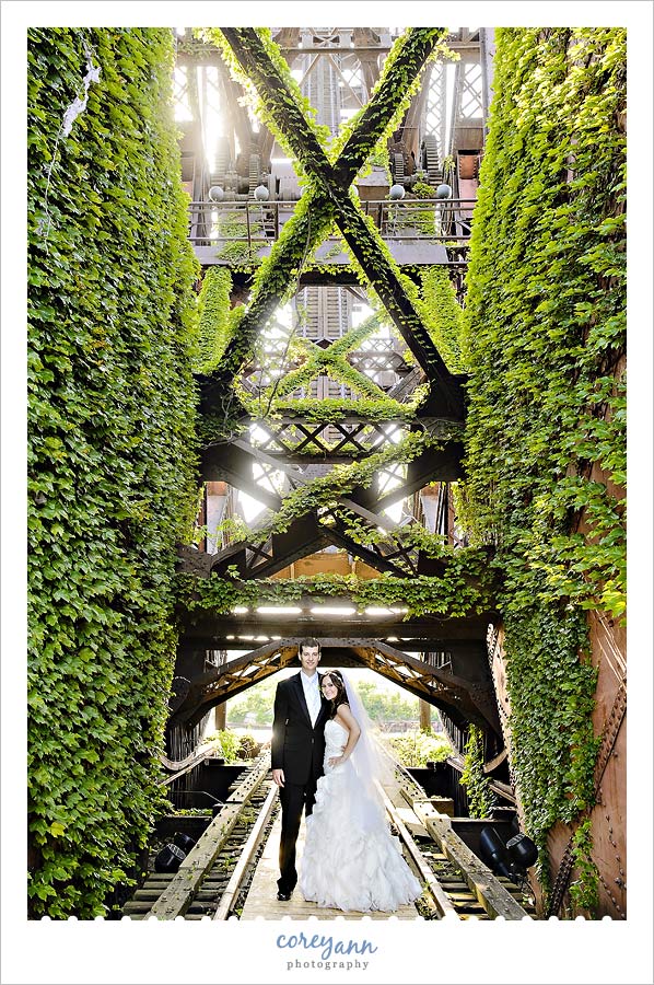 bride and groom inside old bridge on the west bank of the flats in cleveland