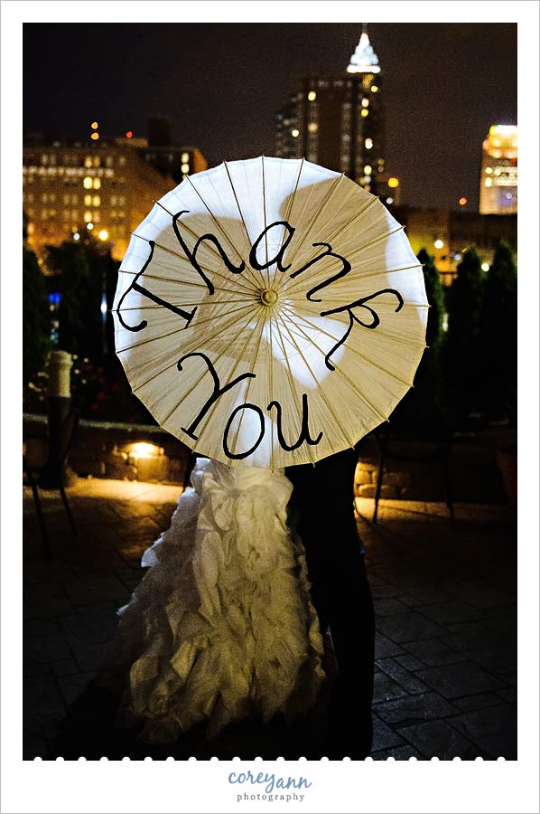 bride and groom silhouette with thank you umbrella