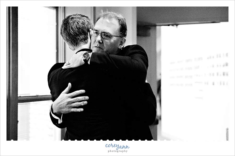 groom's father hugging groom at church in chesterland ohio