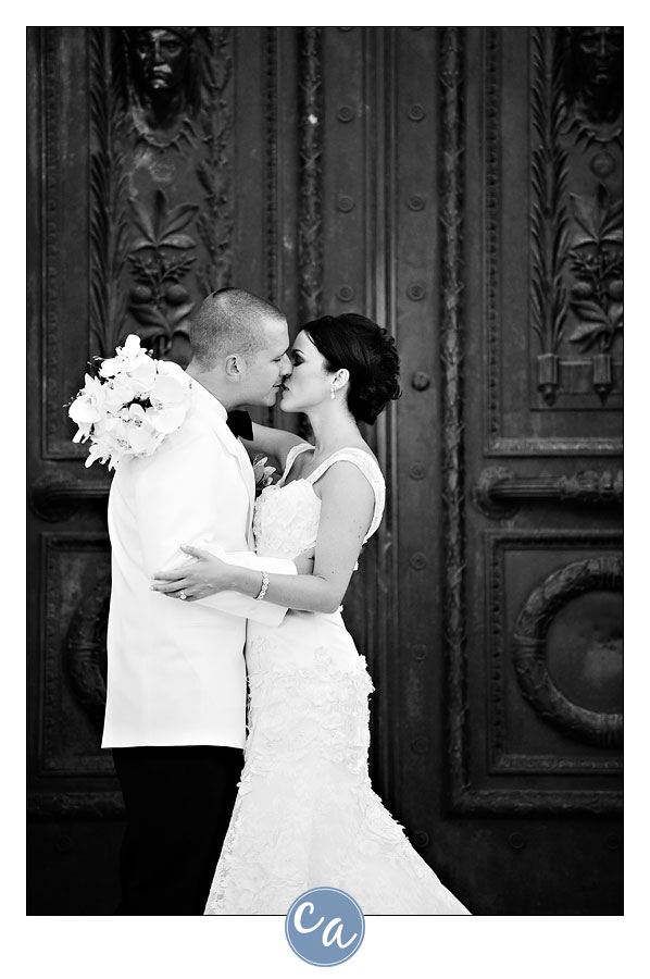 bride and groom in front of door at the old courthouse in cleveland