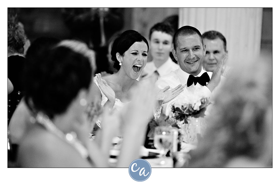 bride and groom laughing during the toasts