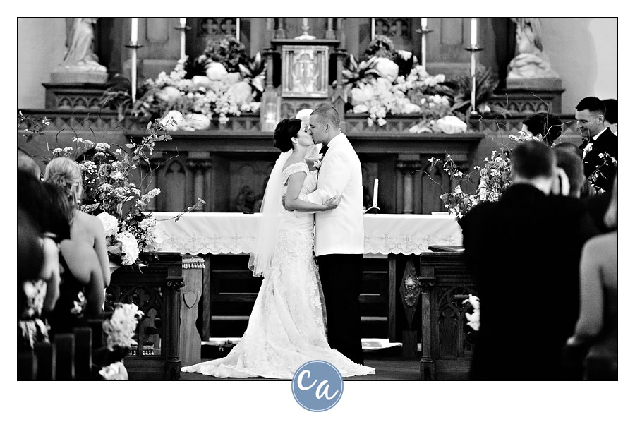 bride and groom first kiss at holy trinity in avon